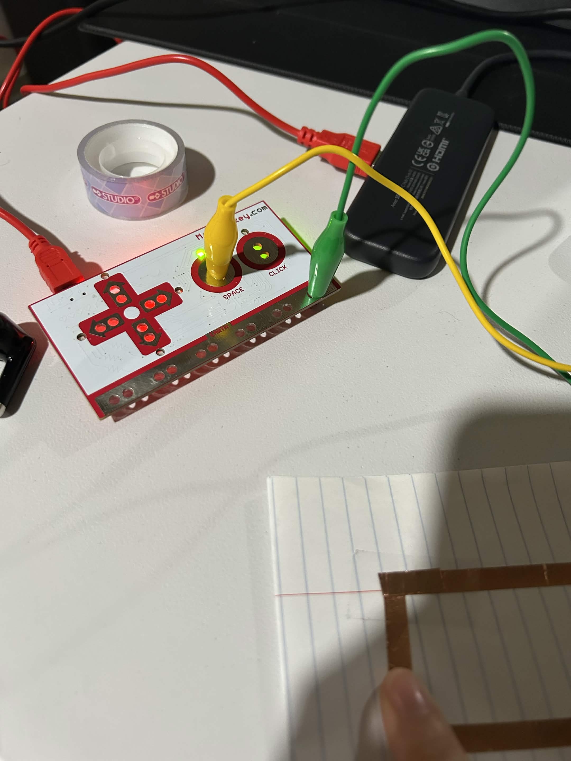 I used the conductive tape and hooked it up to my makey makey and laptop, to make sure it worked, I closed the circuit with my finger. 