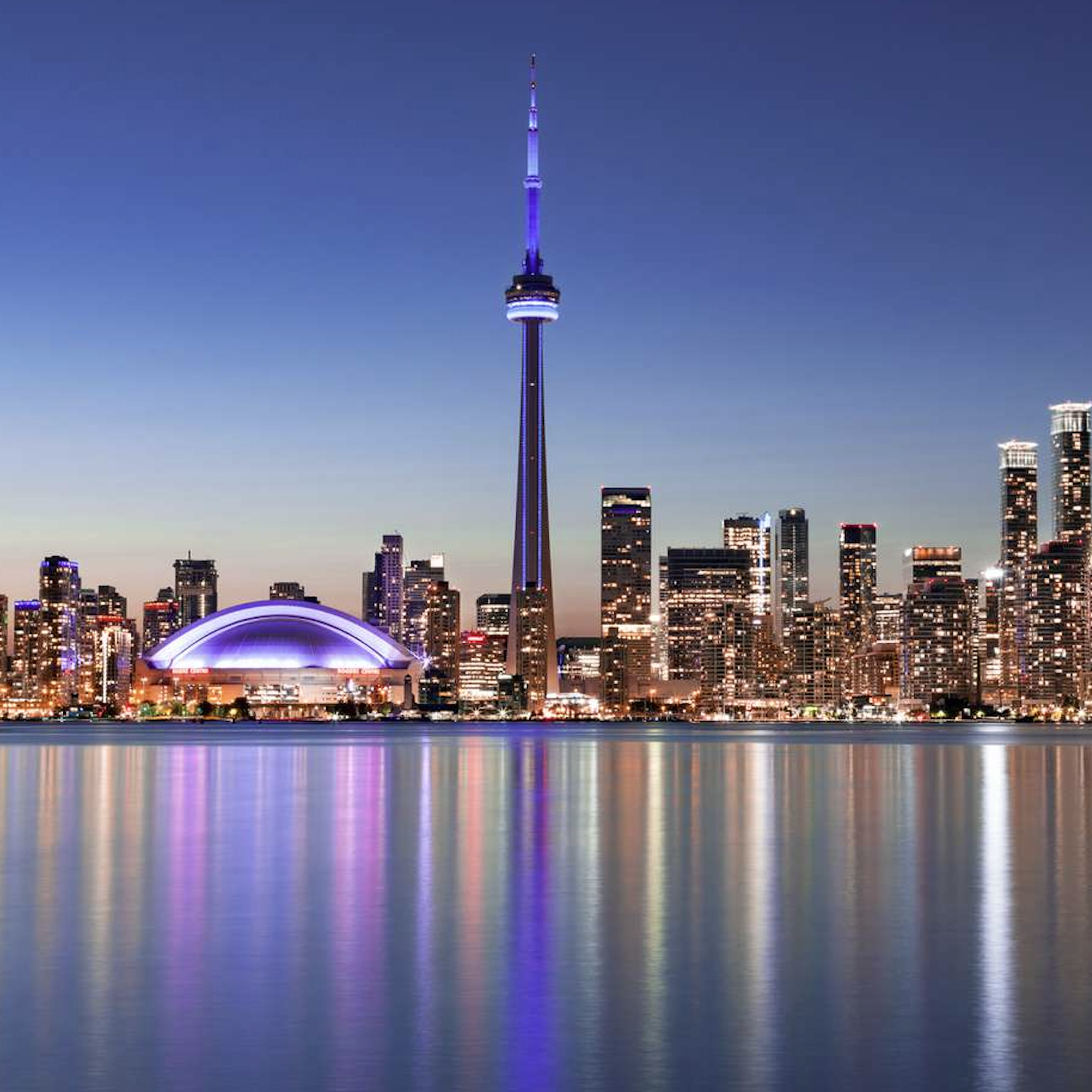 A photo of downtown Toronto at night time.